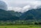 Close up of Fansipan mountain hills valley with forest and fog cloud at sunset. Panoramic view at Sapa, Vietnam. Natural landscape