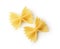 Close-up farfalle. Traditional shape of dry uncooked whole wheat Italian pasta