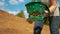 CLOSE UP: Farmer sowing grain in a fertile patch of soil on their large property