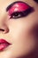 Close up fashion model portrait. Scarlet makeup. Black arrows.
