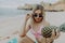 Close up fashion summer portrait woman with perfect tanned fit body wearing trendy sunglasses with pineapple tropical fruit in han