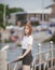 Close-up Fashion woman portrait of young pretty trendy girl posing at the bridge in Thailand,in university uniform