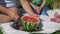 Close Up of Father Cutting Watermelon Outdoors