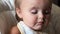 Close up of father`s hand feeds the little girl with soup