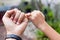 Close up Father and son hands hooking each other on little finger making promise together.