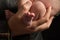 Close Up of Fathers Hands Holding Infant Son