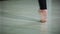 Close-up feet of ballerina in pointe performs dance ballet elements and different exercises in sport gy