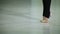 Close-up feet of ballerina in pointe performs dance ballet elements and different exercises in sport gy