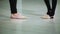 Close-up feet of ballerinas in pointe perform dance ballet elements and different exercises in sport gy