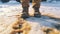 Close-up of feet of man with brown leather boots in the snow. Generative AI