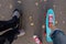 Close up of feet on penny skate board.