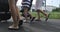 Close-up of the feet of people walking around the city in summer.