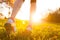 Close up of feet of a runner running in grass