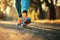 Close-up of feet in sneakers running. Low point of view. Colorful sparkling tones