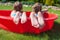 Close-up of feet two sisters in small pool