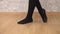 Close up of the feet of an unrecognizable female dancer getting ready for a dance training session