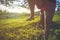 Close up on feet walking on tightrope or slackline outdoor in a city park in sun shine light - slacklining, balance, training conc