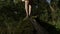 Close up with feet of woman walking bare foot on tree bear moss in the forest nature -