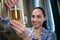 Close-up of female brewer testing beer