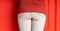 Close up of female buttocks in jeans. Rear view on buttocks of unrecognizable woman.