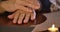 Close-up of female Caucasian hands touching cards lying at the table. Cartomancy, clairvoyance, fortune telling