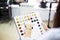 Close up of a female client examining hair color chart at the hairdressing studio coloring dyeing variety changing women hair care