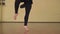 Close up of female contemporary dancer legs choreography making pirouettes in slow motion