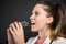 Close-up of female doctor eating bunch of blisters with tablets