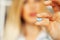 Close up of female doctor holding pill for men health