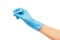 Close up of female doctor\'s hand in blue sterilized surgical glove with blue plastic catheter against white