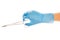 Close up of female doctor\'s hand in blue sterilized surgical glove with forceps against white