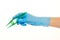 Close up of female doctor\'s hand in blue sterilized surgical glove with green plastic forceps against white