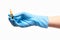Close up of female doctor\'s hand in blue sterilized surgical glove holding transparent brown glass ampoule with a drug