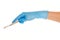 Close up of female doctor\'s hand in blue sterilized surgical glove with scalpel against white