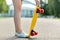 Close up of female feet with short skateboard