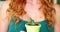 Close-up of female florist holding potted plant
