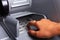 Close Up of Female Hand entering Personal Identification Number at an ATM Machine To Withdraw Cash. Close Up. ATM Transaction.