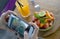 Close up female hand with mobile phone screen taking picture of fruit salad and orange juice for sharing on internet social media