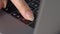 Close-up female hand pressing a Backspace key for delete on laptop keyboard