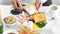 Close-up female hand spreading butter on fried bread toast using knife enjoying breakfast food