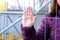 Close-up of a female hand, woman in an iron cage, quiet cry for help, concept of domestic violence, being in prison, captivity,