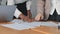 Close up female hands african and caucasian young business people woman diverse colleague meeting in office. Two