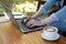 Close up female hands of a business freelance using laptop computer