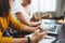 Close-up of female hands hold modern smartphone at her workplace at office