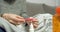 Close up of female hands holding an electronic thermometer. Measurement of body temperature during an illness