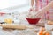 Close up of female hands kneading dough at home