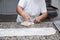 Close up of female hands kneading dough and making banitsa