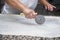 Close up of female hands kneading dough and making banitsa