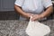 Close up of female hands kneading dough and making banitsa