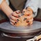 Close up of Female Hands Making Handcrafted Clay Dishes on Pottery Wheel at Master Class